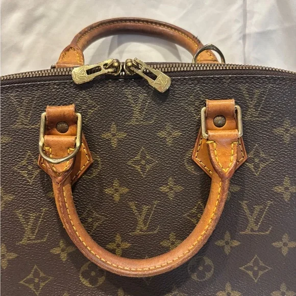 Louis Vuitton Alma Monogram Coated Canvas Handbag - Picture 4 of 16